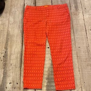 Orange pants with circle pattern.